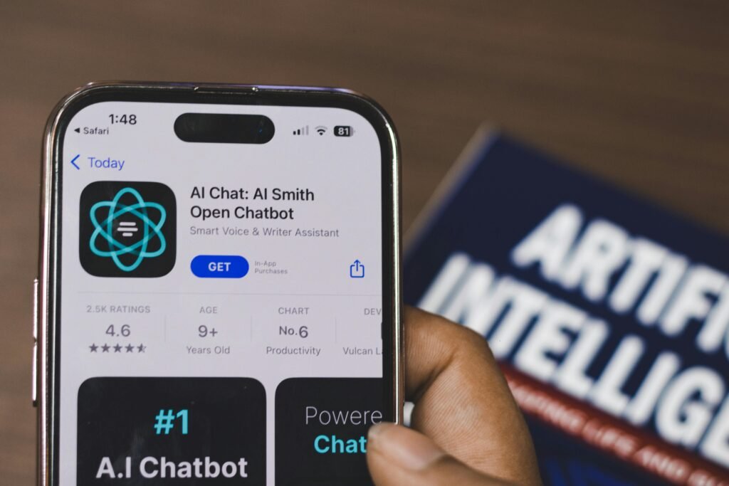 pexels-photo-16380905-16380905 Hand holding a smartphone with AI chatbot app, emphasizing artificial intelligence and technology.